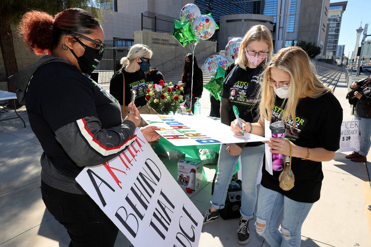 Kianna Grant, from left, Madison McCarthy and Tilly Spietz sign a birthday card for Jorge Gomez ...