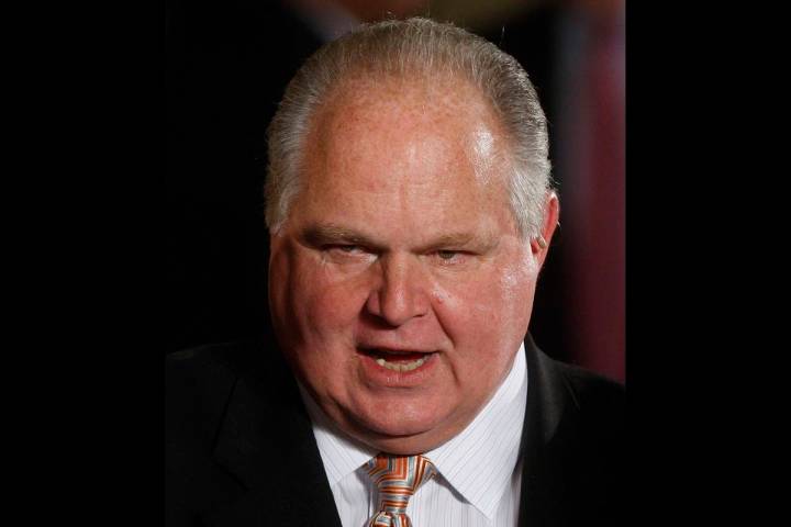 FILE - In this Jan. 13, 2009 file photo, conservative talk show host Rush Limbaugh talks with g ...