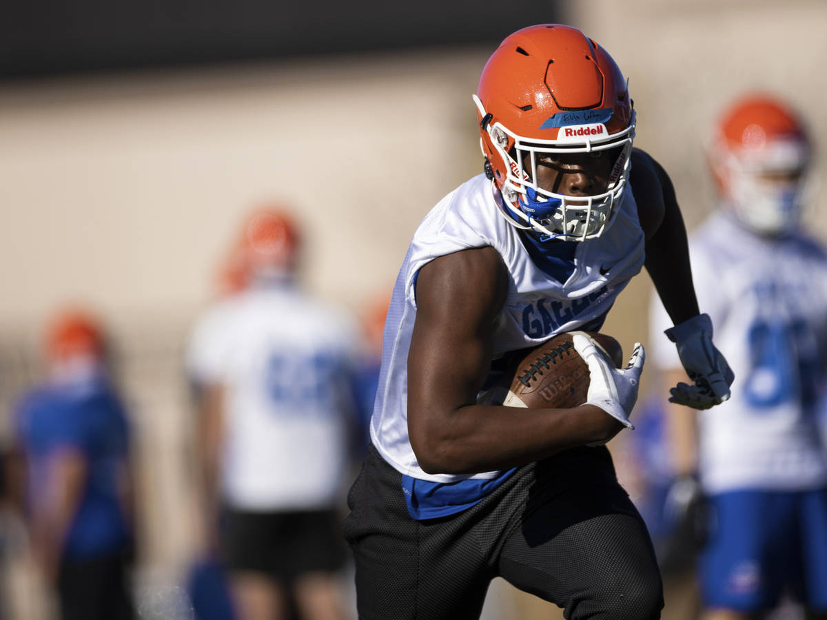 Bishop Gorman's Elija Lofton (28) works through receiving drills during practice on Friday, Feb ...