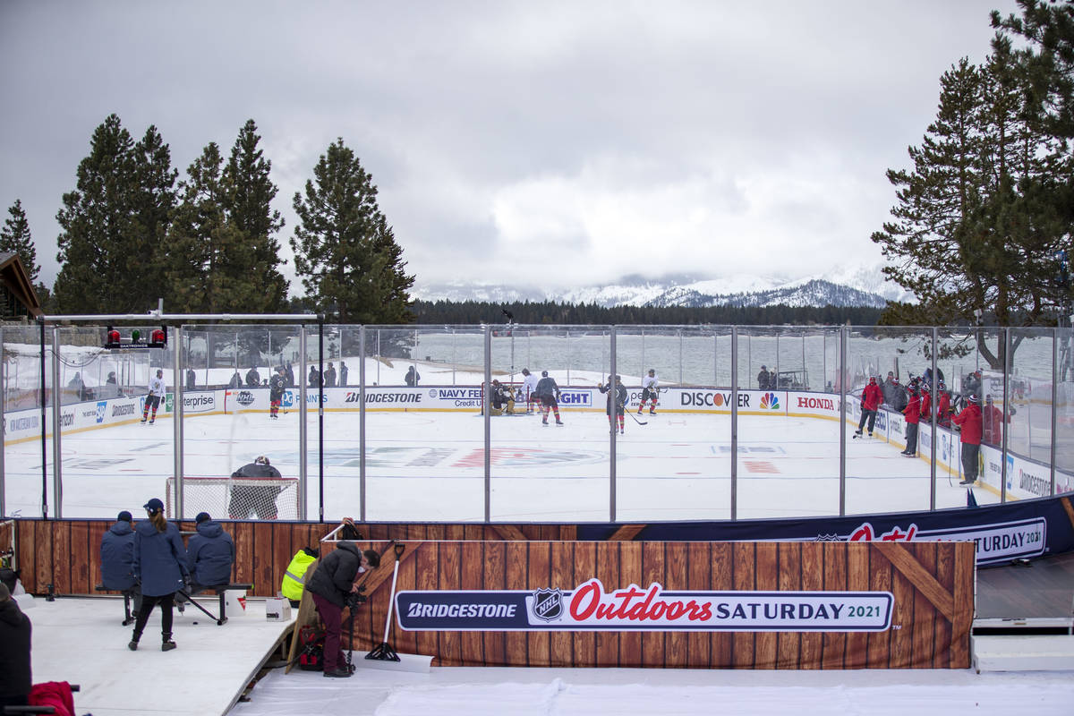 Vegas Golden Knights practice on an outdoor rink built over the 18th fairway of a golf course i ...