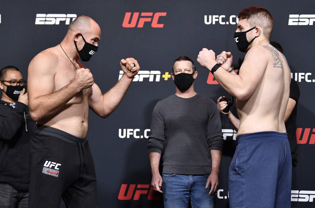 (L-R) Opponents Aleksei Oleinik of Russia and Chris Daukaus face off during the UFC weigh-in at ...