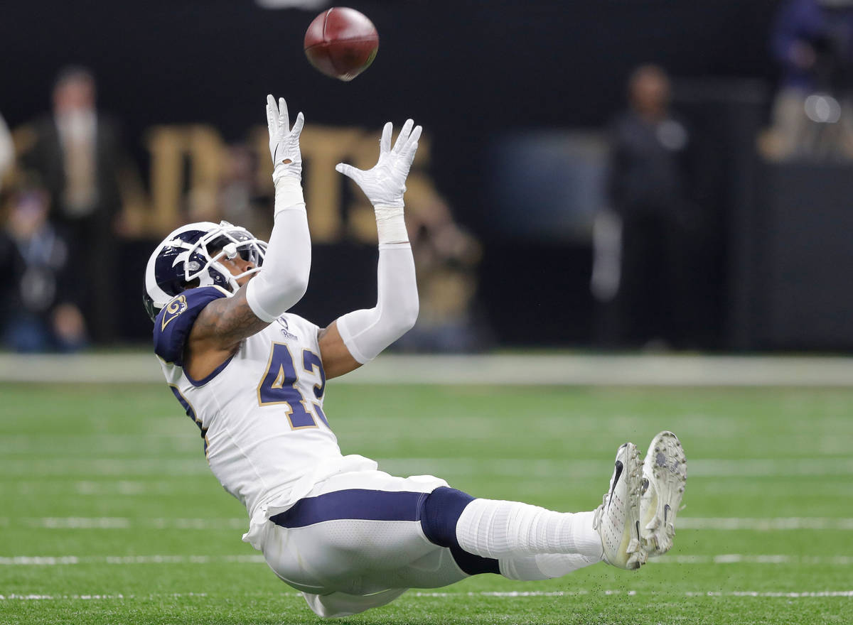 Los Angeles Rams' John Johnson intercepts a pass during the second half of the NFL football NFC ...