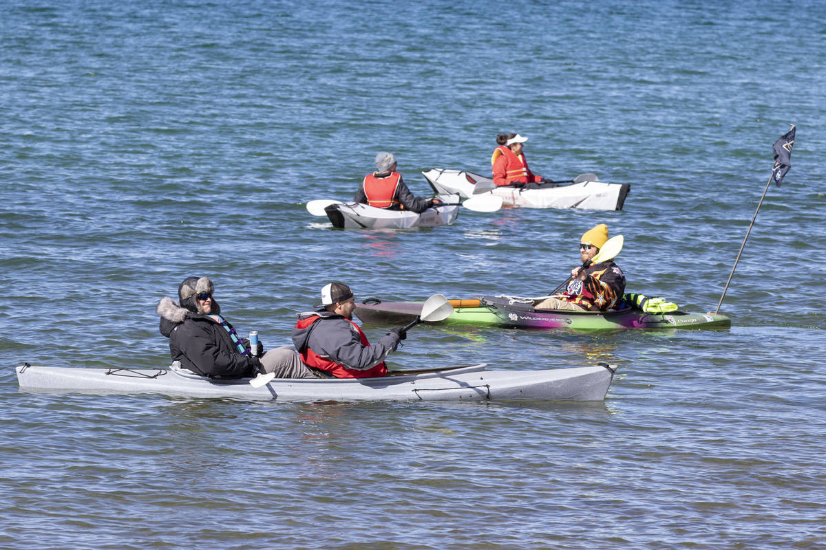 Fans kayak in Lake Tahoe before an NHL hockey game between the Vegas Golden Knights and the Col ...