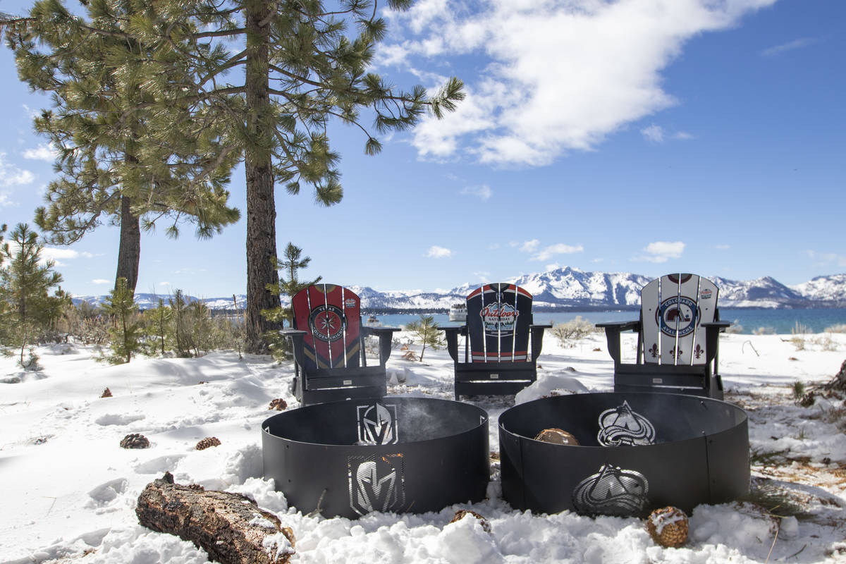 Chairs showing the teams logos are placed near fire pits on Lake Tahoe during the first period ...