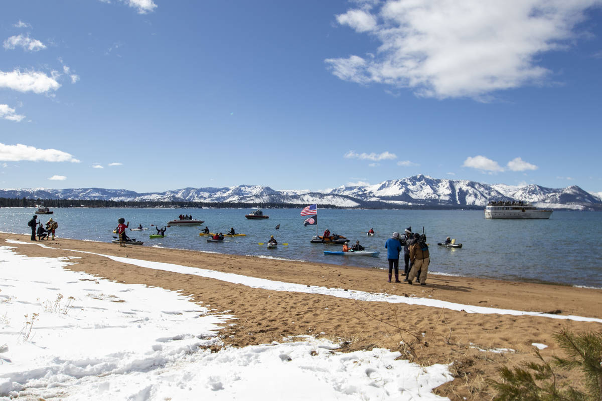 Hockey fans kayak in Lake Tahoe during the first period of an NHL hockey game between the Vegas ...