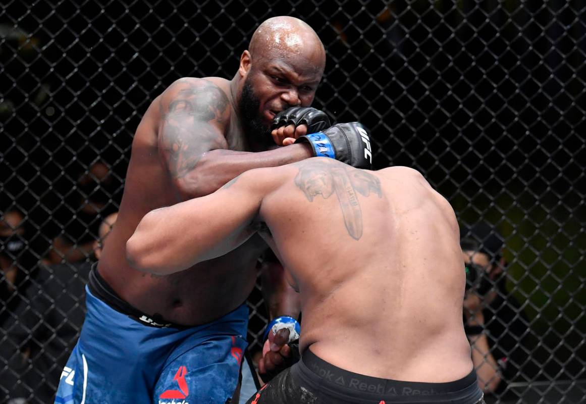 (L-R) Derrick Lewis punches Curtis Blaydes in a heavyweight bout during the UFC Fight Night eve ...