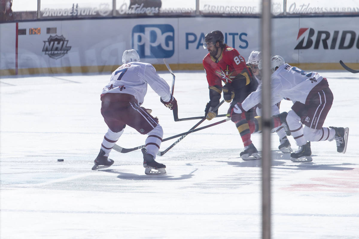Vegas Golden Knights right wing Alex Tuch (89) controls th puck as Colorado Avalanche defenseme ...