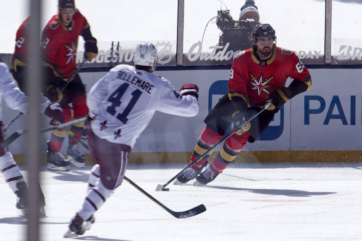 Vegas Golden Knights right wing Alex Tuch (89) handles the puck as Colorado Avalanche center Pi ...