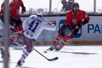 Vegas Golden Knights right wing Alex Tuch (89) handles the puck as Colorado Avalanche center Pi ...