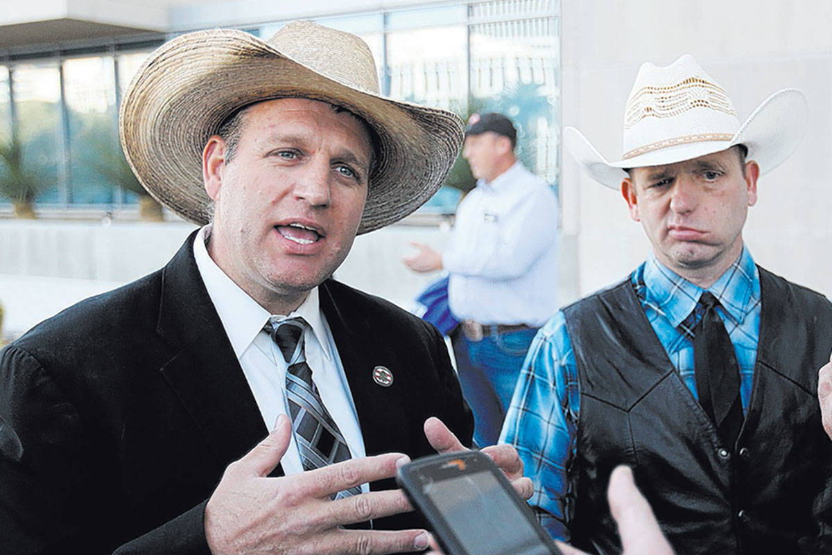 Defendants Ammon Bundy, left, and his brother Ryan Bundy, talk to the news media outside the Ll ...
