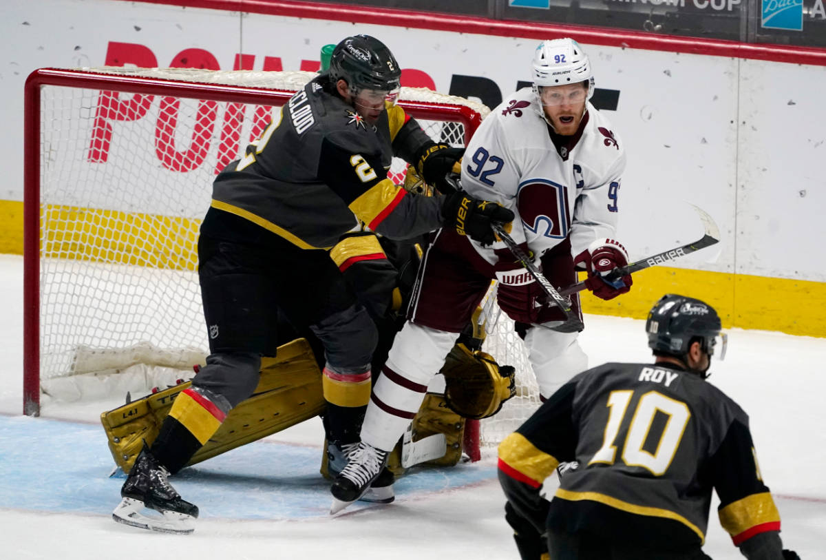 Colorado Avalanche left wing Gabriel Landeskog, back, right, fights for position in front of th ...