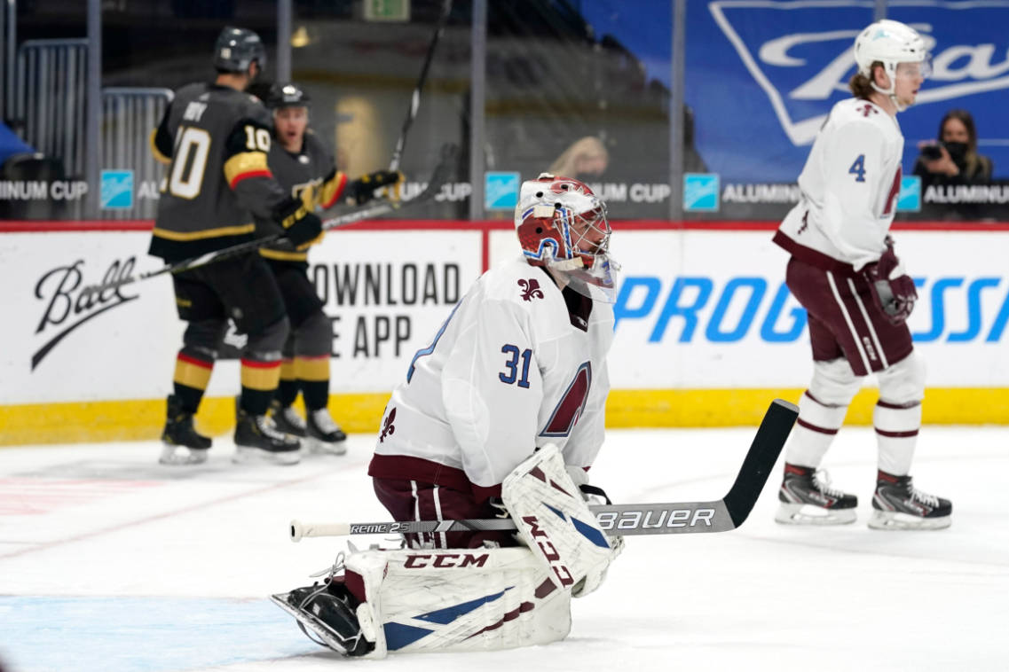 Colorado Avalanche goaltender Philipp Grubauer, front, reacts after giving up a goal to Vegas G ...
