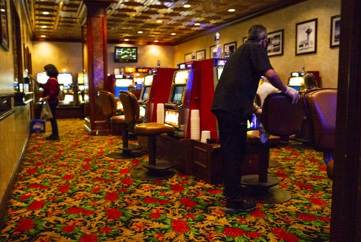 A worker sanitizes a gaming area at the El Cortez on Thursday, June 4, 2020. (Chase Stevens/Las ...