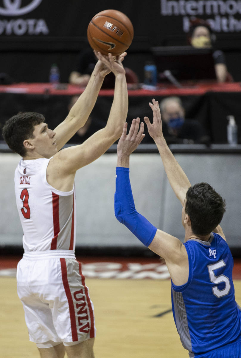 UNLV Rebels guard Caleb Grill (3) shoots over Air Force Falcons guard Chris Joyce (5) in the fi ...