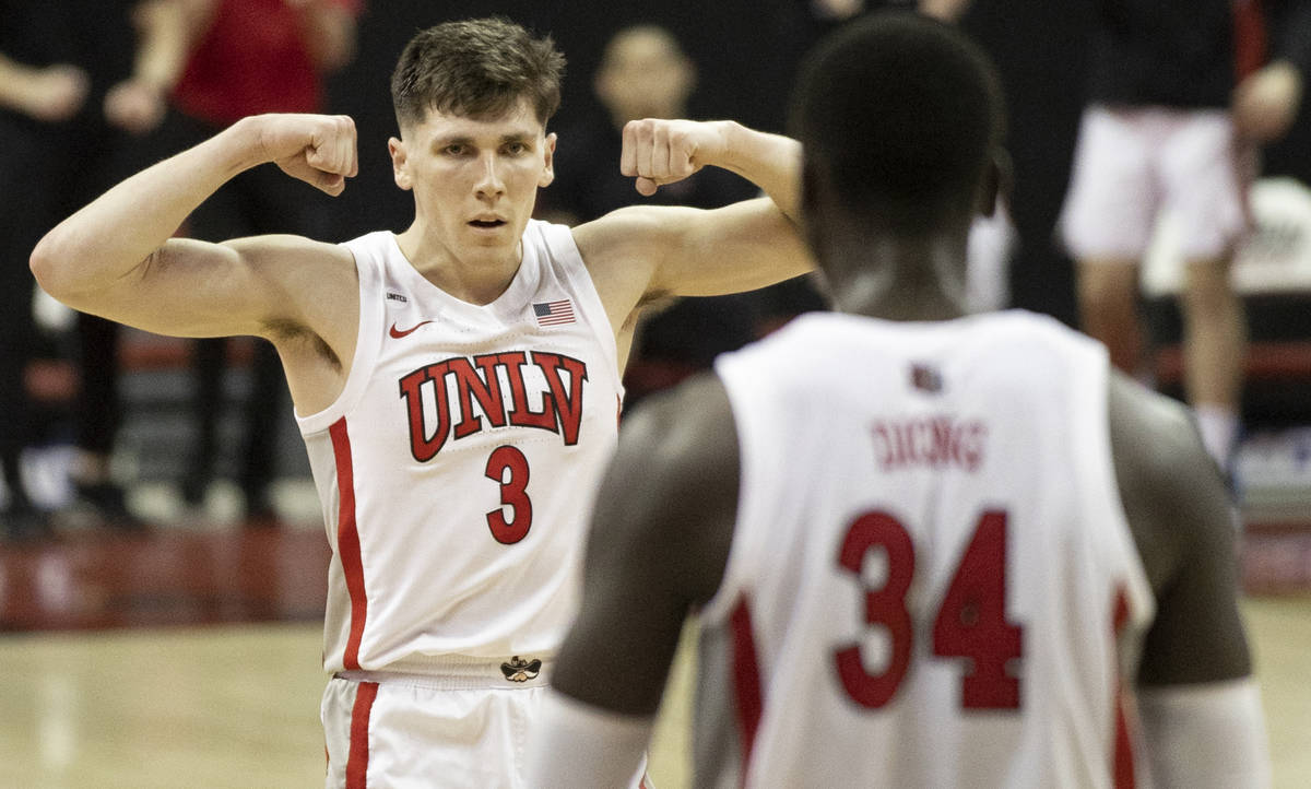 UNLV Rebels guard Caleb Grill (3) celebrates with UNLV Rebels forward Cheikh Mbacke Diong (34) ...