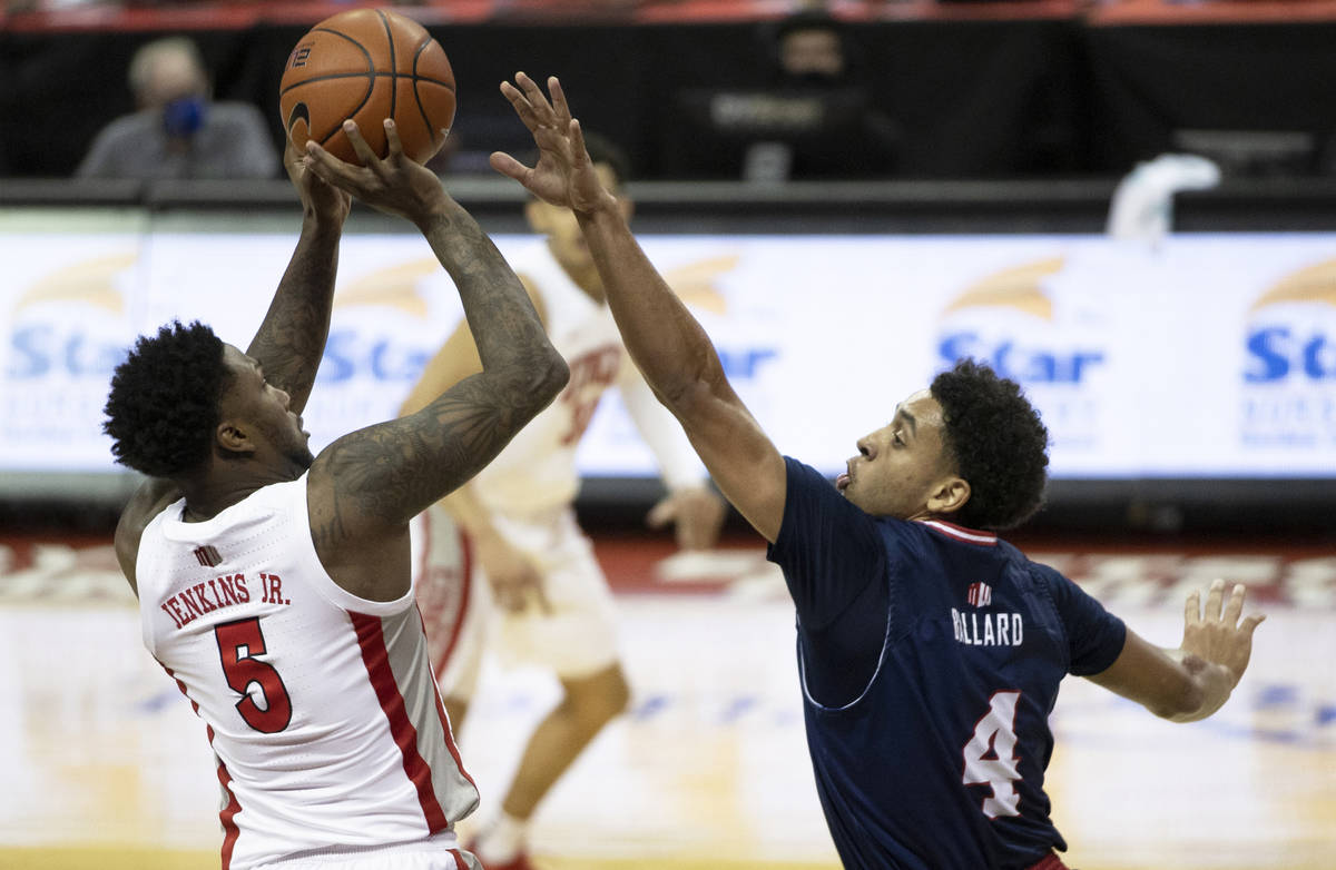 UNLV Rebels guard David Jenkins Jr. (5) shoots a three point shot over Fresno State Bulldogs gu ...