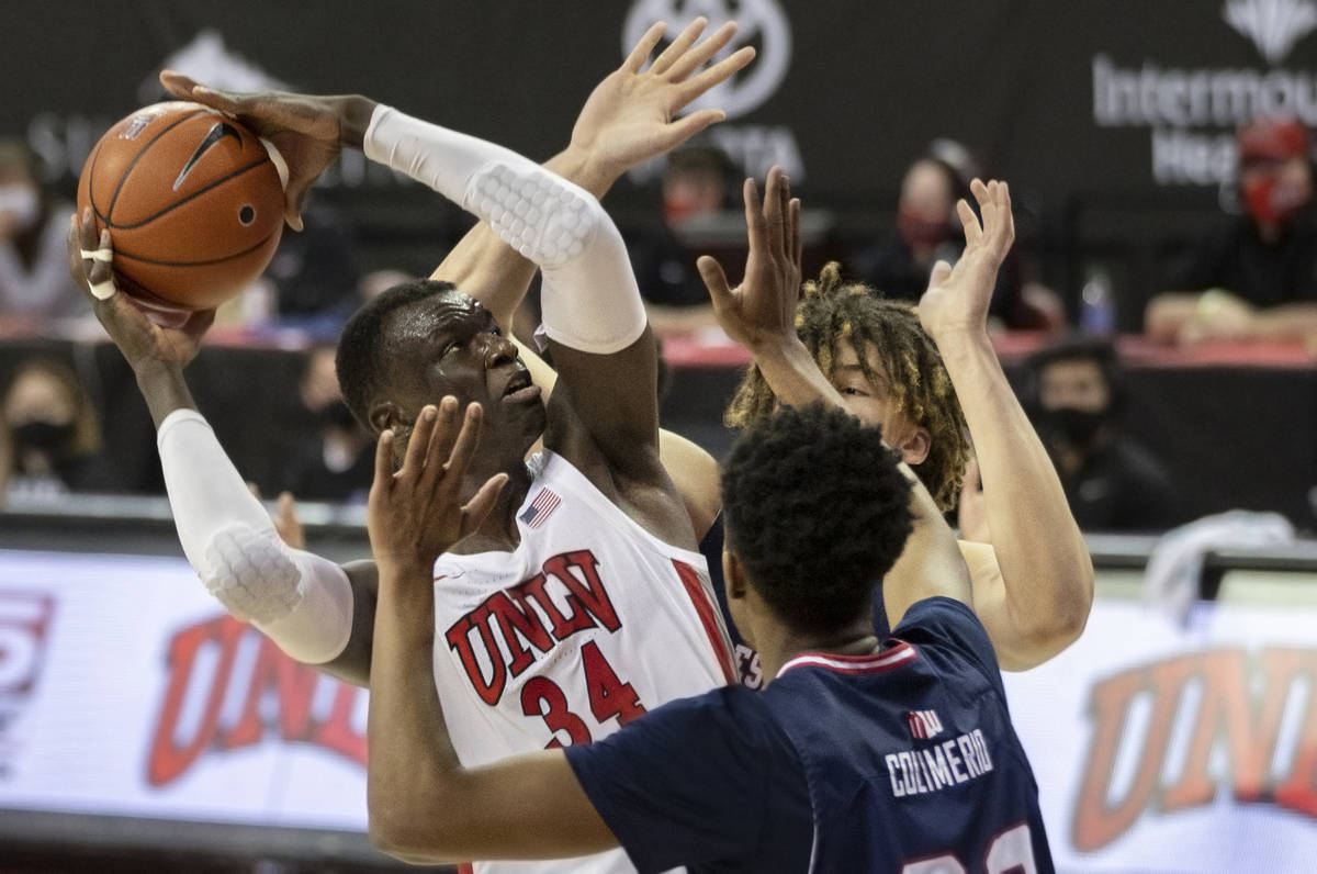 UNLV Rebels forward Cheikh Mbacke Diong (34) shoots over Fresno State Bulldogs forward Leo Coli ...
