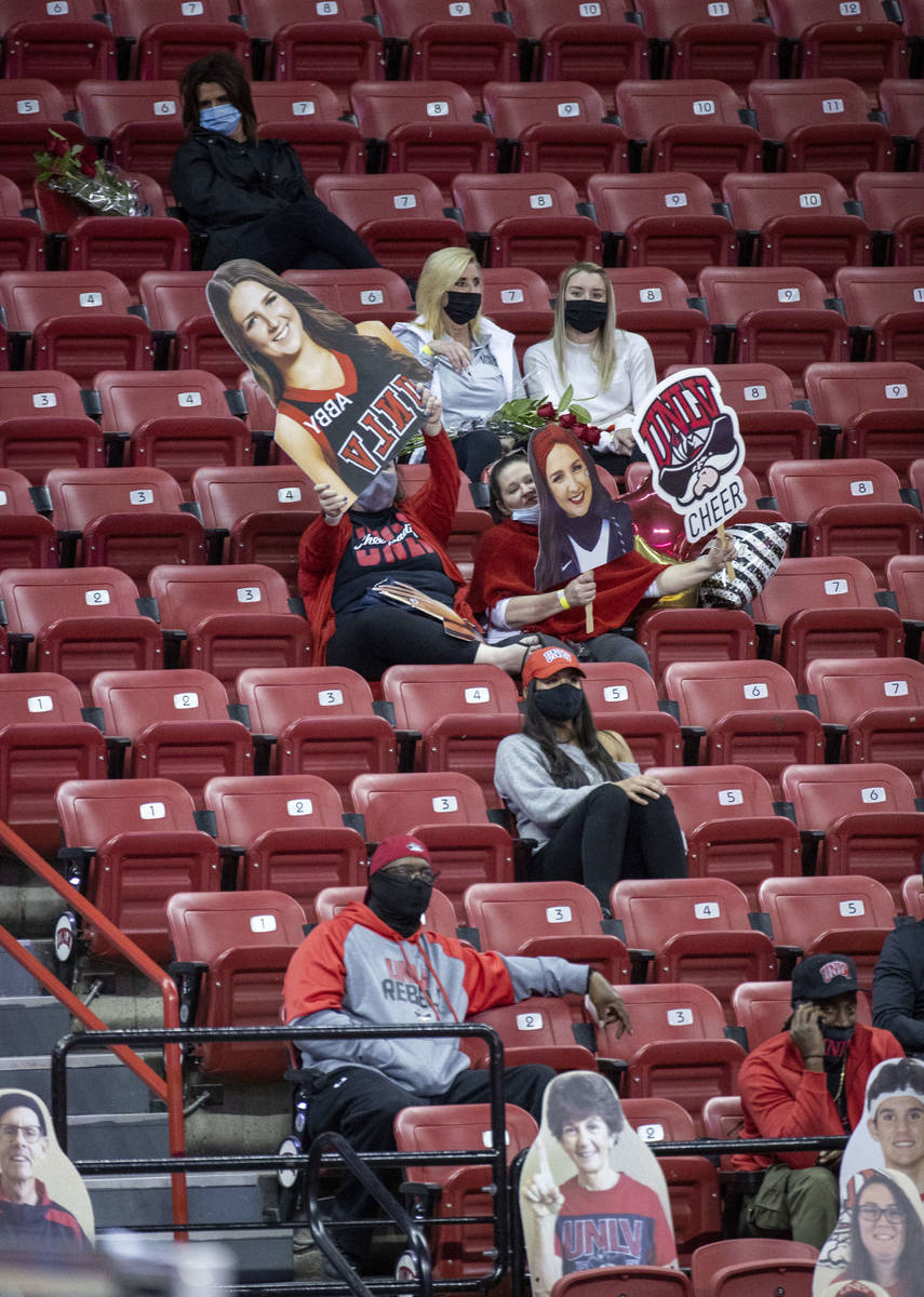 UNLV Rebels fans celebrate their cheer and spirit squad during a timeout in the second half of ...