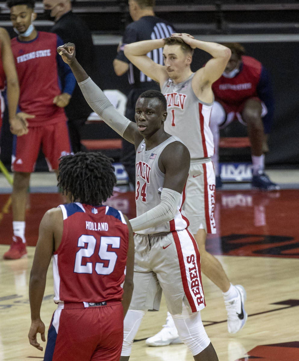UNLV Rebels forward Cheikh Mbacke Diong (34) celebrates their 68-67 win while eyeing Fresno Sta ...