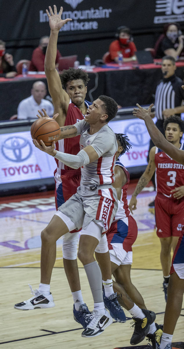 UNLV Rebels guard Nicquel Blake (22) goes up strong to the basket over Fresno State Bulldogs fo ...