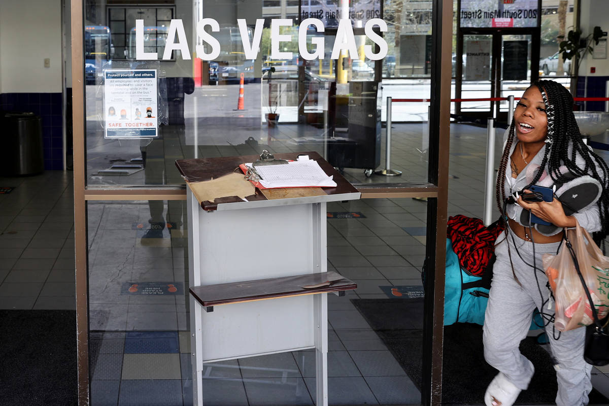 The final customer runs to catch the final bus leaving the Greyhound bus terminal on Main Stree ...