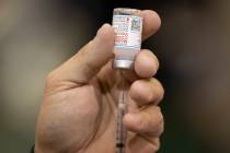 A Moderna COVID-19 vaccine is prepared at the Neighborhood Recreation Center in North Las Vegas ...