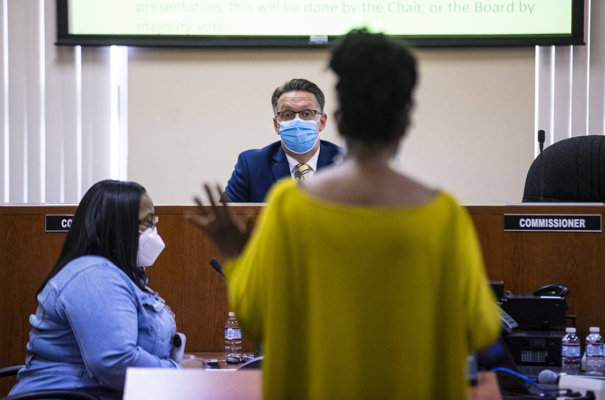 Board chairman Scott Black, left, listens to Deloris Sawyer as she addresses the Southern Nevad ...