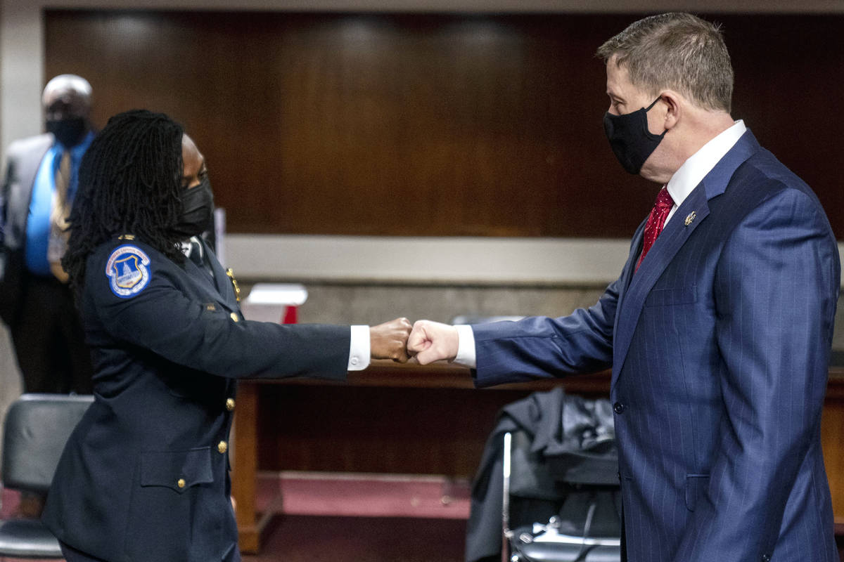 Former U.S. Capitol Police Chief Steven Sund, right, and Capitol Police Captain Carneysha Mendo ...