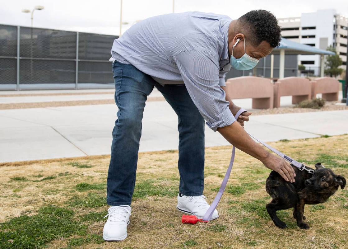 Ronald Pipkins, who was the first presumptive positive case of COVID-19 in Nevada, walks his do ...