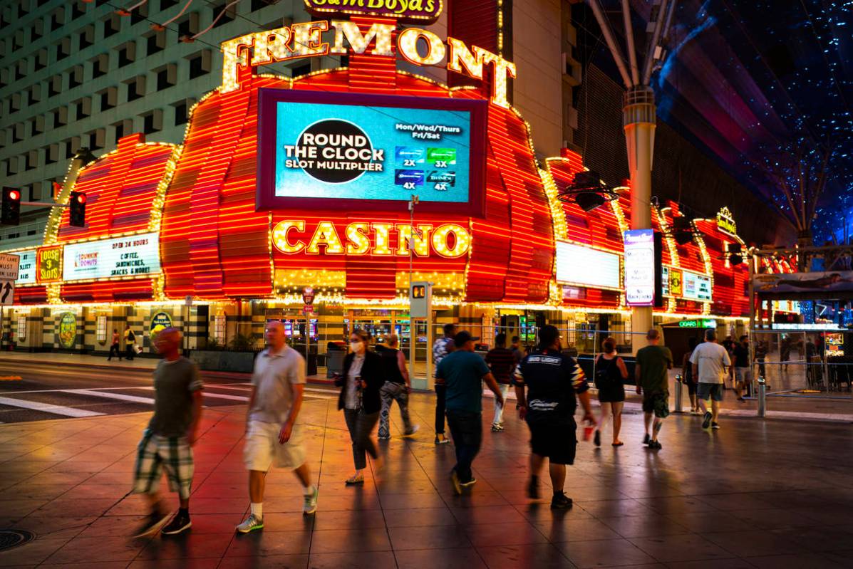 People cross Casino Center Boulevard outside of the Fremont in a June 3, 2020, file photo. (Cha ...