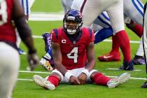 Houston Texans quarterback Deshaun Watson (4) sits on the turf after losing a fumble to the Ind ...