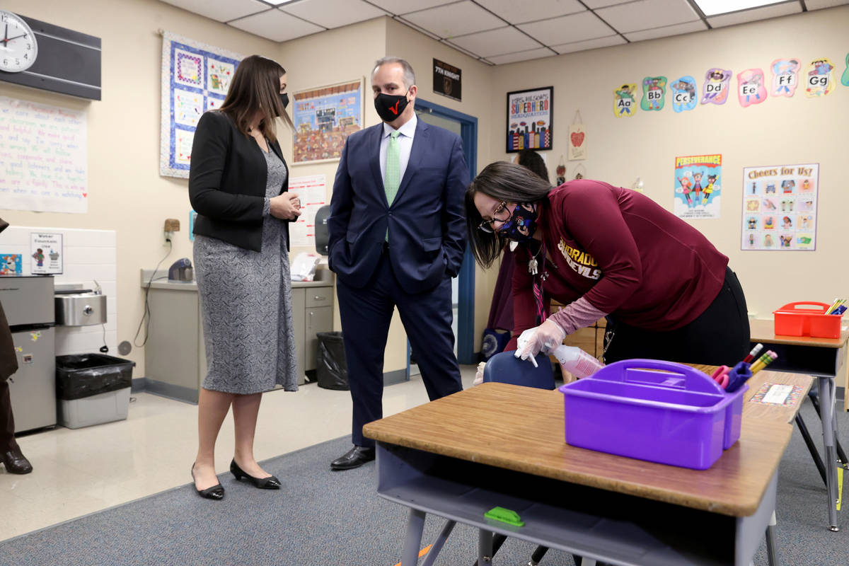 Clark County School District Support Staff Trainer Tia Baker sanitizes a classroom at Eisenberg ...