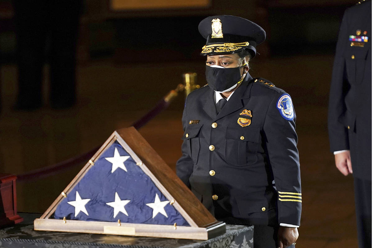 In a Feb. 2, 2021, file photo, acting U.S. Capitol Police Chief Yogananda Pittman pays respects ...