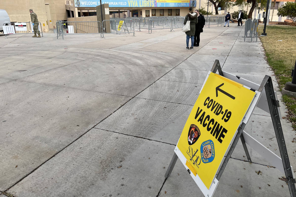 People arrive for COVID-19 vaccines at Cashman Center in Las Vegas Wednesday, Jan. 26, 2021. (K ...