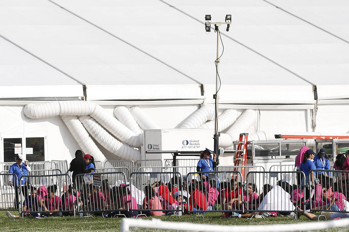 Immigrant children are shown outside a former Job Corps site that houses them in Homestead, Fla ...