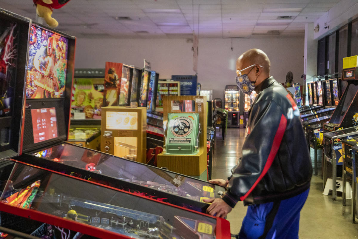 Oliver Blair, 46, of San Antonio, Texas, plays games at the Pinball Hall of Fame in 2020 in Las ...
