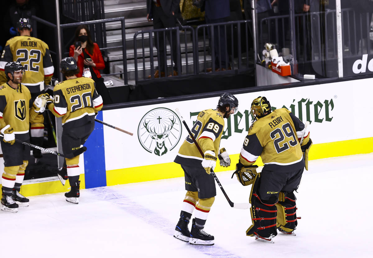 Golden Knights right wing Alex Tuch (89) celebrates a 1-0 shutout win with goaltender Marc-Andr ...