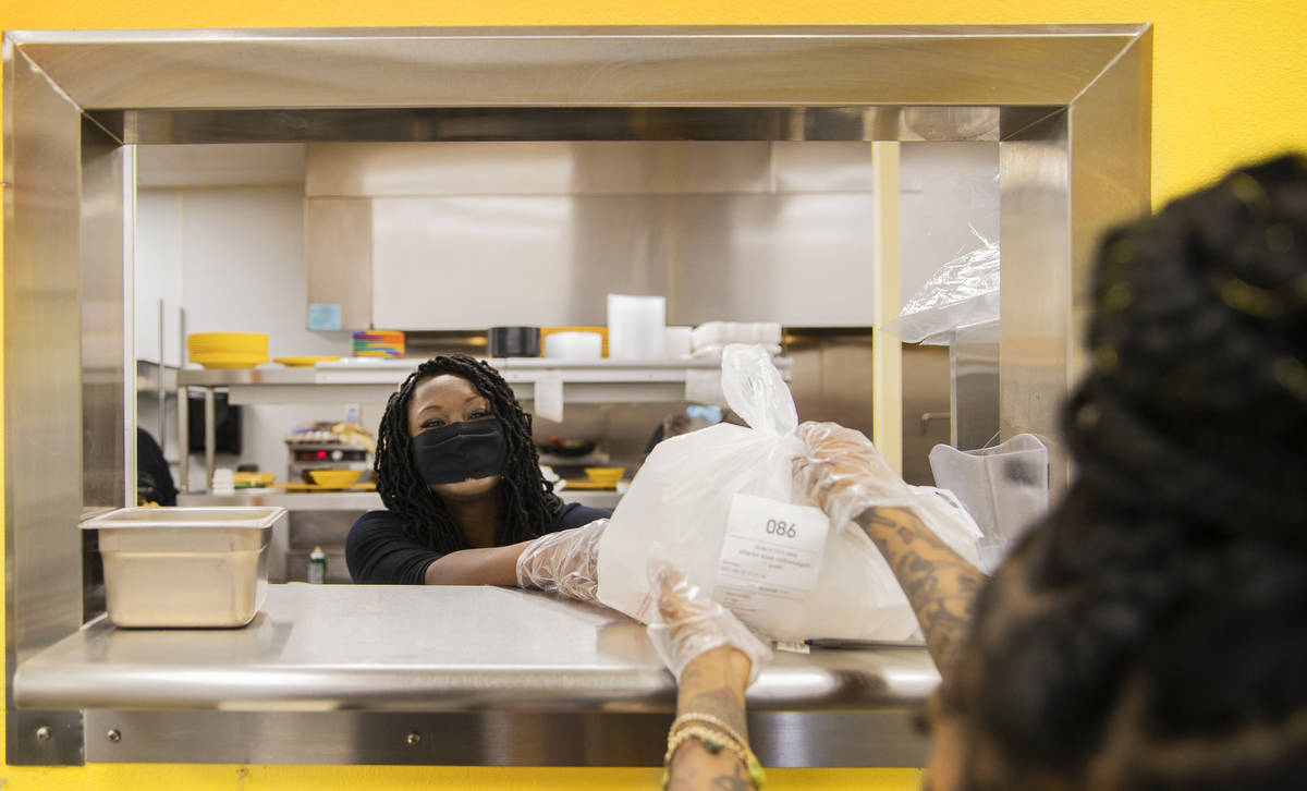 Gritz Cafe owner Trina Jiles, left, works in the kitchen on Saturday, Feb. 27, 2021, in Las Veg ...