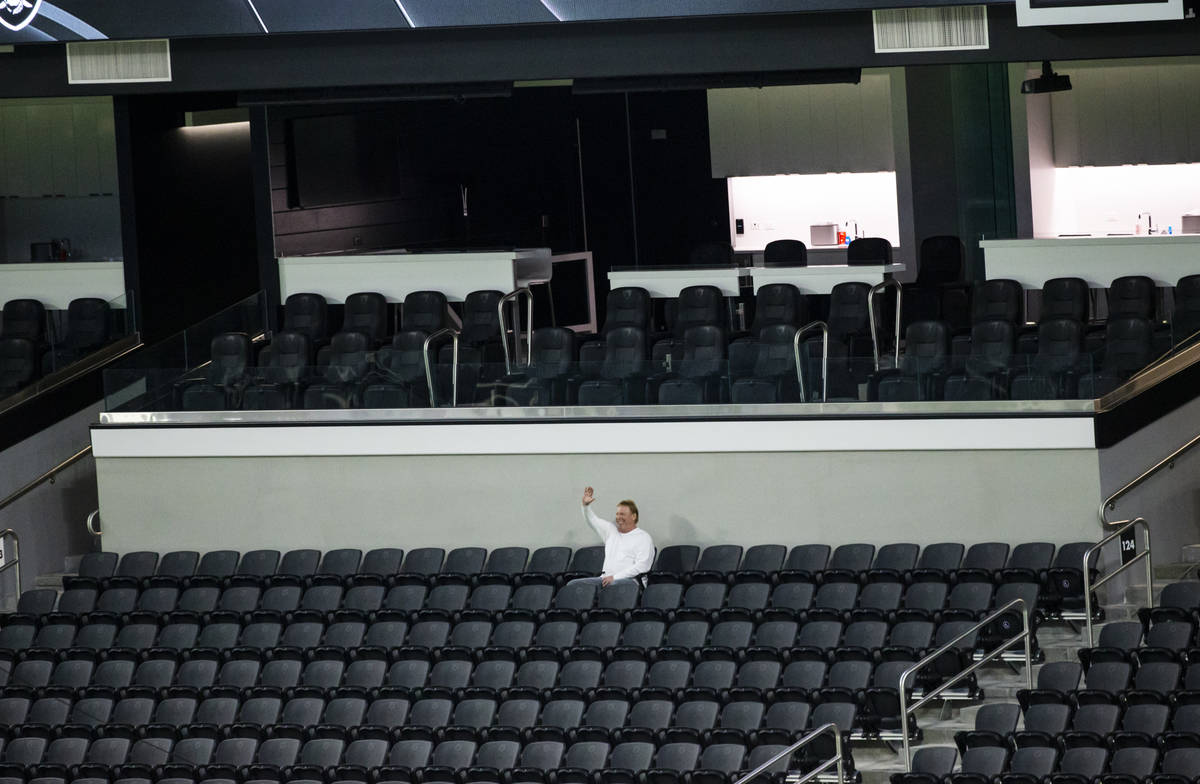 Mark Davis, owner of the Las Vegas Raiders, waves from his seat as members of Santa Fe & Th ...