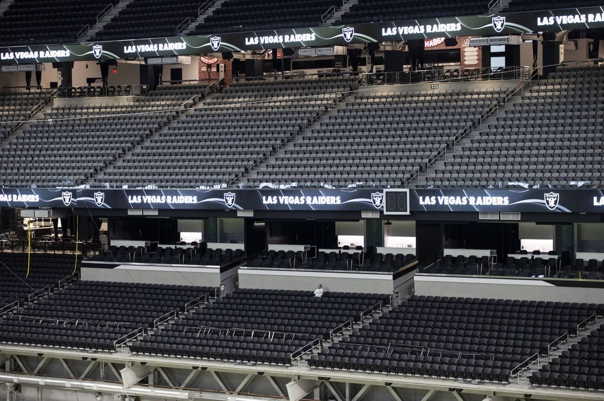Mark Davis, owner of the Las Vegas Raiders, watches as members of Santa Fe & The Fat City H ...