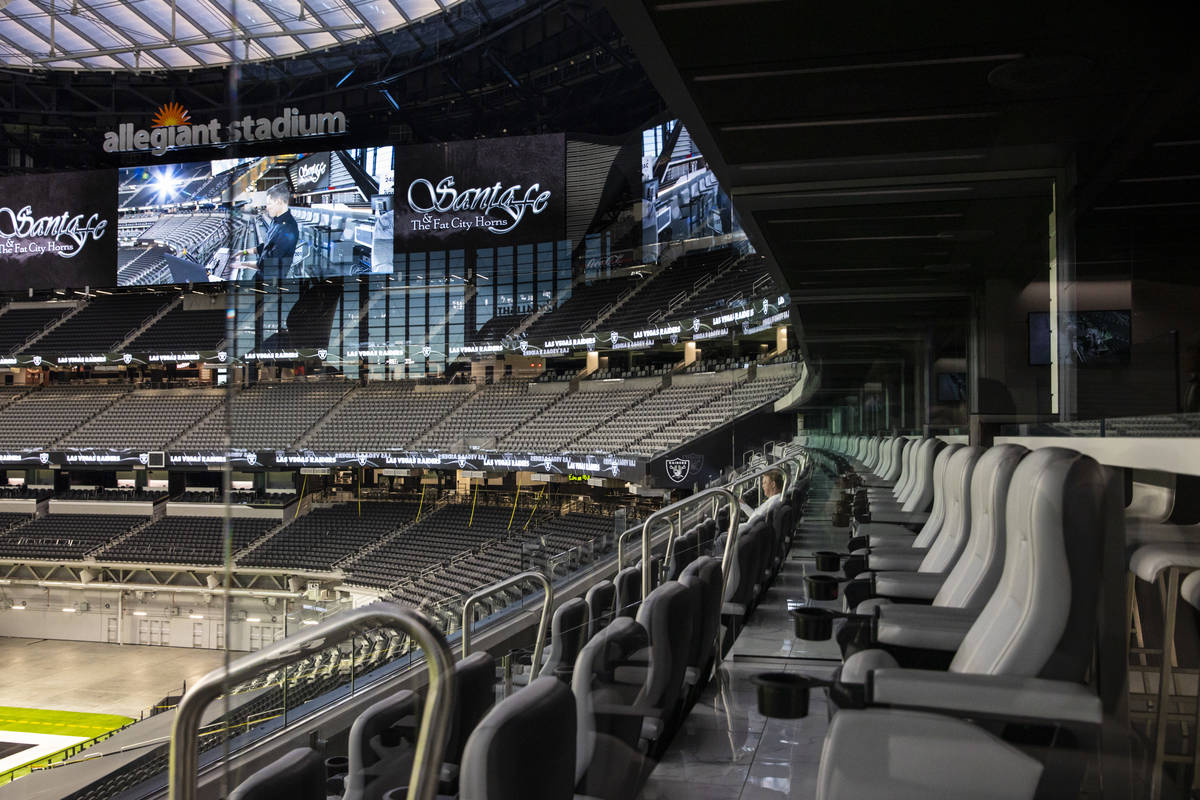 Mark Davis, owner of the Las Vegas Raiders, listens as members of Santa Fe & The Fat City H ...