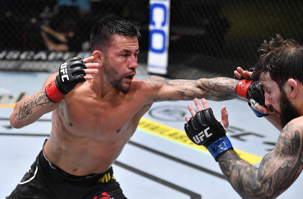LAS VEGAS, NEVADA - FEBRUARY 27: (L-R) Pedro Munhoz of Brazil punches Jimmie Rivera in a bantam ...