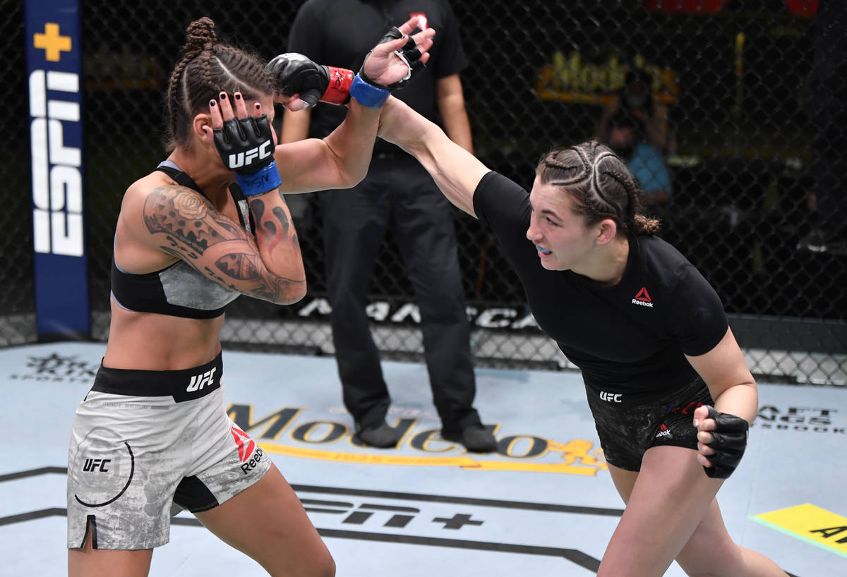 LAS VEGAS, NEVADA - FEBRUARY 27: (R-L) Montana De La Rosa punches Mayra Bueno Silva of Brazil i ...