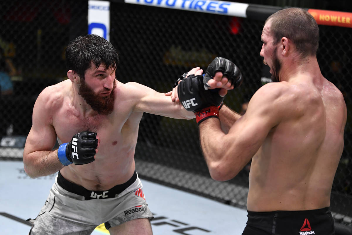 LAS VEGAS, NEVADA - FEBRUARY 27: (L-R) Magomed Ankalaev of Russia punches Nikita Krylov of the ...
