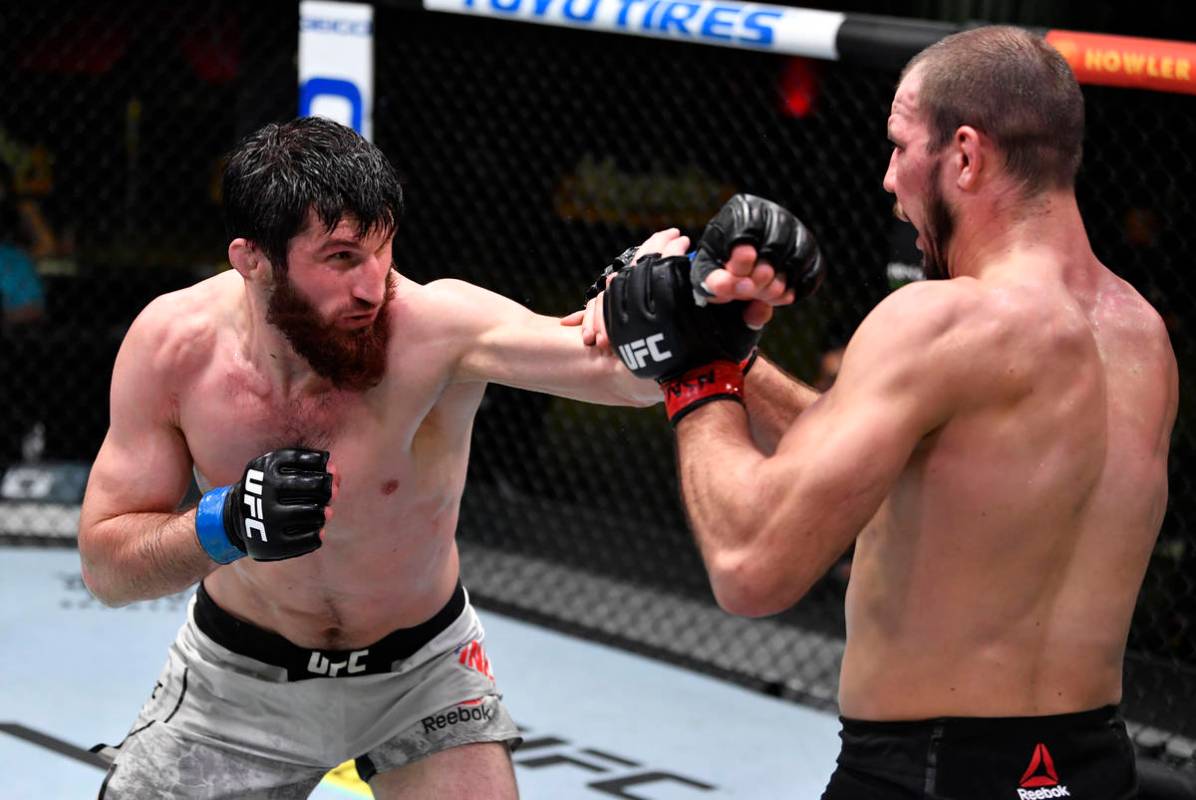 LAS VEGAS, NEVADA - FEBRUARY 27: (L-R) Magomed Ankalaev of Russia punches Nikita Krylov of the ...