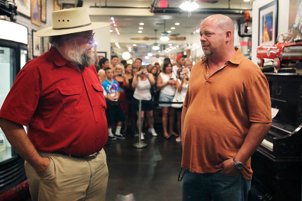 Mark Hall-Patton, left, talks with Gold & Silver Pawn owner Rick Harrison. Since 2009, Hall-Pat ...