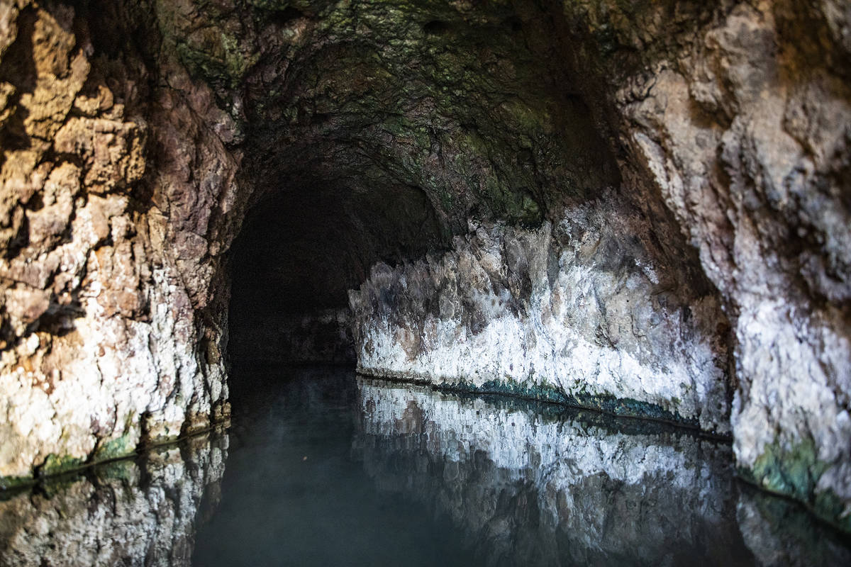 From the river’s edge, a short trail leads to the dark and muggy Sauna Cave, which flows with ...