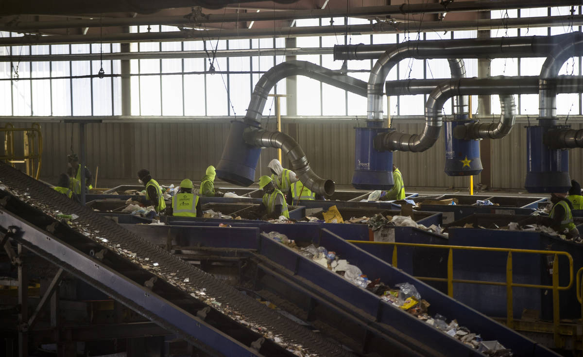 Workers on the pre-sort deck pull out nonrecyclable material and larger items at the Republic S ...