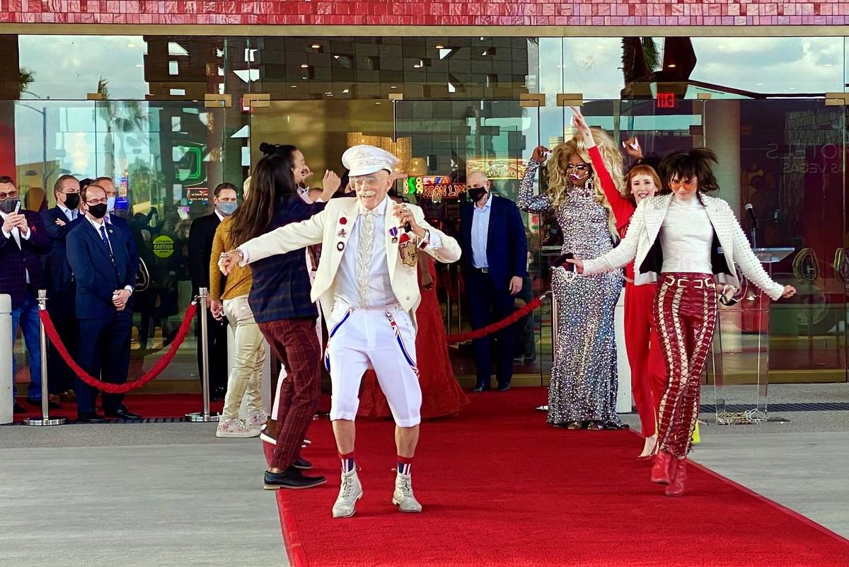 Doc Phineas Kastle, center, dancers move up the red carpet and into the venue during the Virgin ...