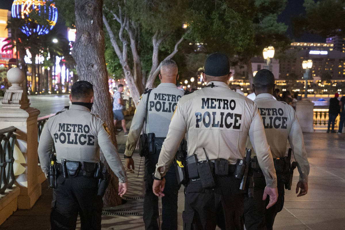 Las Vegas Metro Police are seen patrolling near the Bellagio hotel and casino fountains on the ...